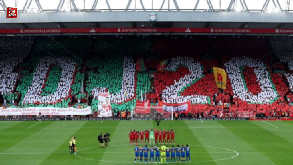 Fans at Anfield lifted cards to create mosaics in tribute to Diogo Jota and Andre Silva. Michael Steele/Getty Images