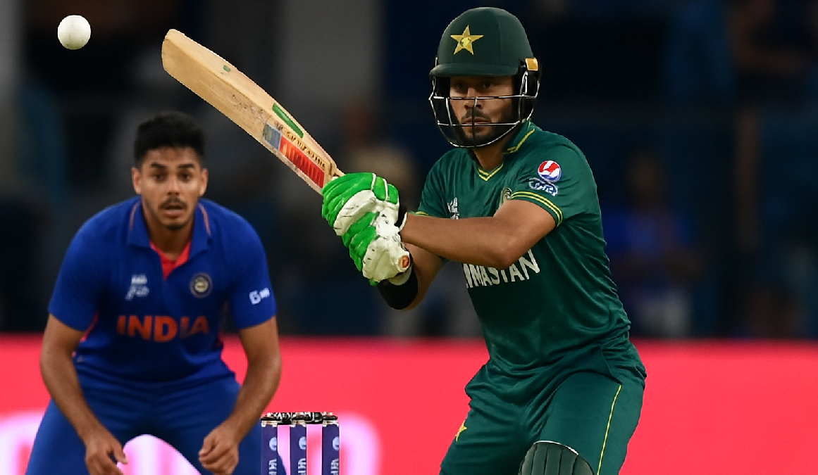 Sahibzada Farhan batting for Pakistan against India while Abhishek Sharma fields during Asia Cup 2025 Super 4s match.