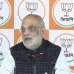 West Bengal mein Kolkata press conference ke dauran Amit Shah BJP sarkar ke vikas aur ghuspeth khatm karne ka wada karte hue